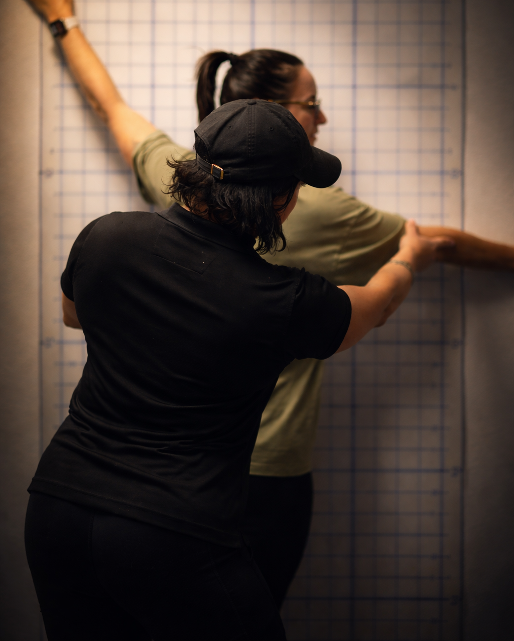 Karen Garrett performing postural alignment assessment